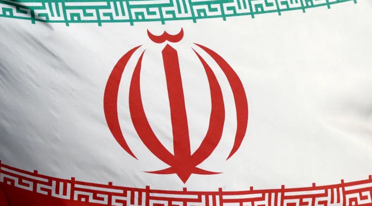 The Iranian flag flies in front of the IAEA headquarters in Vienna.