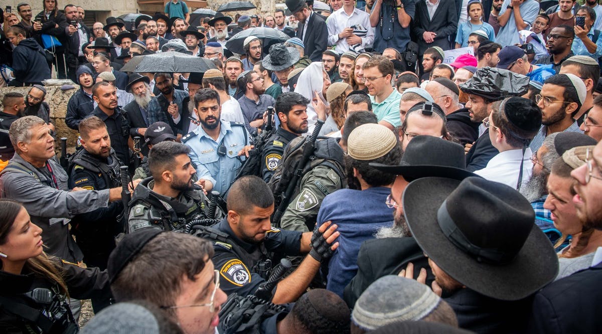 Jewish activists clash with police during a protest against a conference of Christians outside the Davidson Center in Jerusalem, Israel