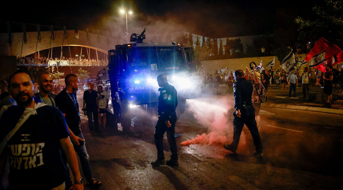 Anti-overhaul activists clash with police during a protest against the government's judicial overhaul