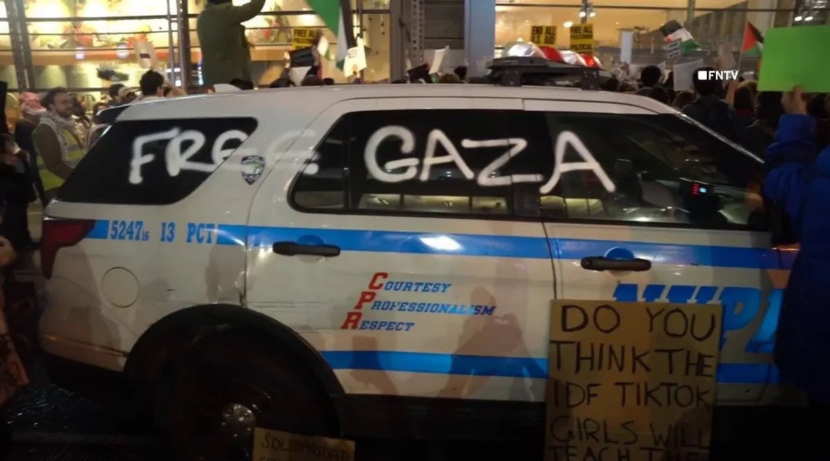 Pro-Palestinian rioters on Thursday spray painted "free Gaza" on an NYPD cruiser outside the New York Times headquarters