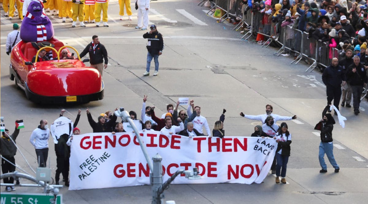People demonstrate during the 97th Macy's Thanksgiving Day Parade, in Manhattan, New York City