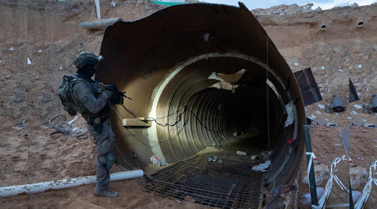A soldier stands at the entrance to a large Hamas tunnel found near the Erez border crossing in the northern Gaza Strip
