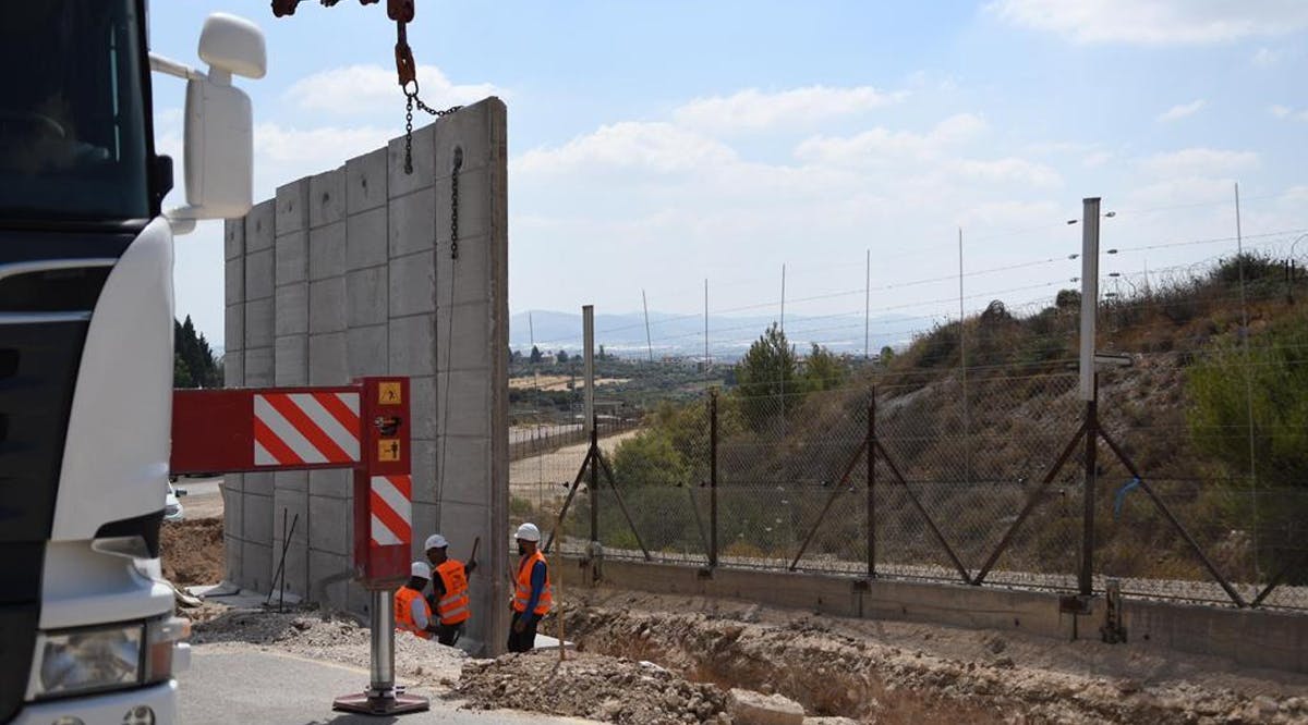 Construction work begins to upgrade a section of the West Bank security barrier