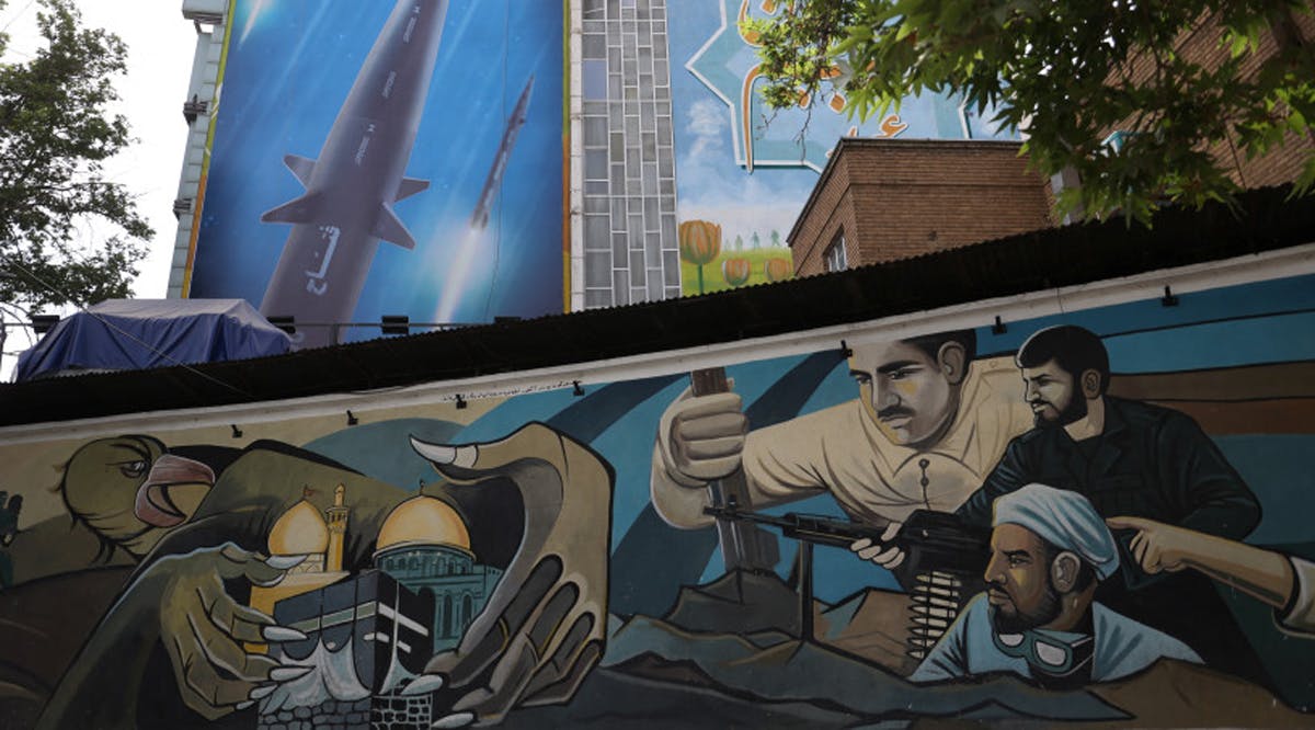 A billboard with a photo of a new hypersonic ballistic missile called "Fattah" and with text reading "400 seconds to Tel Aviv" is seen on a building in Tehran, Iran