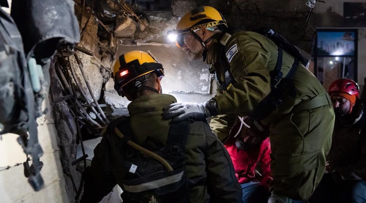 Israeli rescue personnel rescue a 9-year-old boy from under rubble in Kahramanmaraş, Turkey