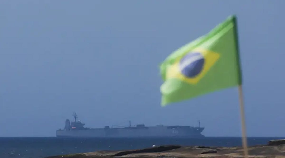 Iranian military ship Iris Makran navigates on the coast of Rio de Janeiro as a Brazilian flag flutters in Copacabana Beach, Brazil