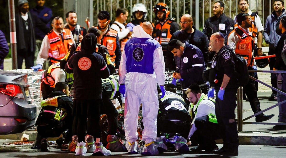 Security forces and rescue forces at the scene of a deadly terror shooting in Jerusalem's Neve Yaakov neighborhood