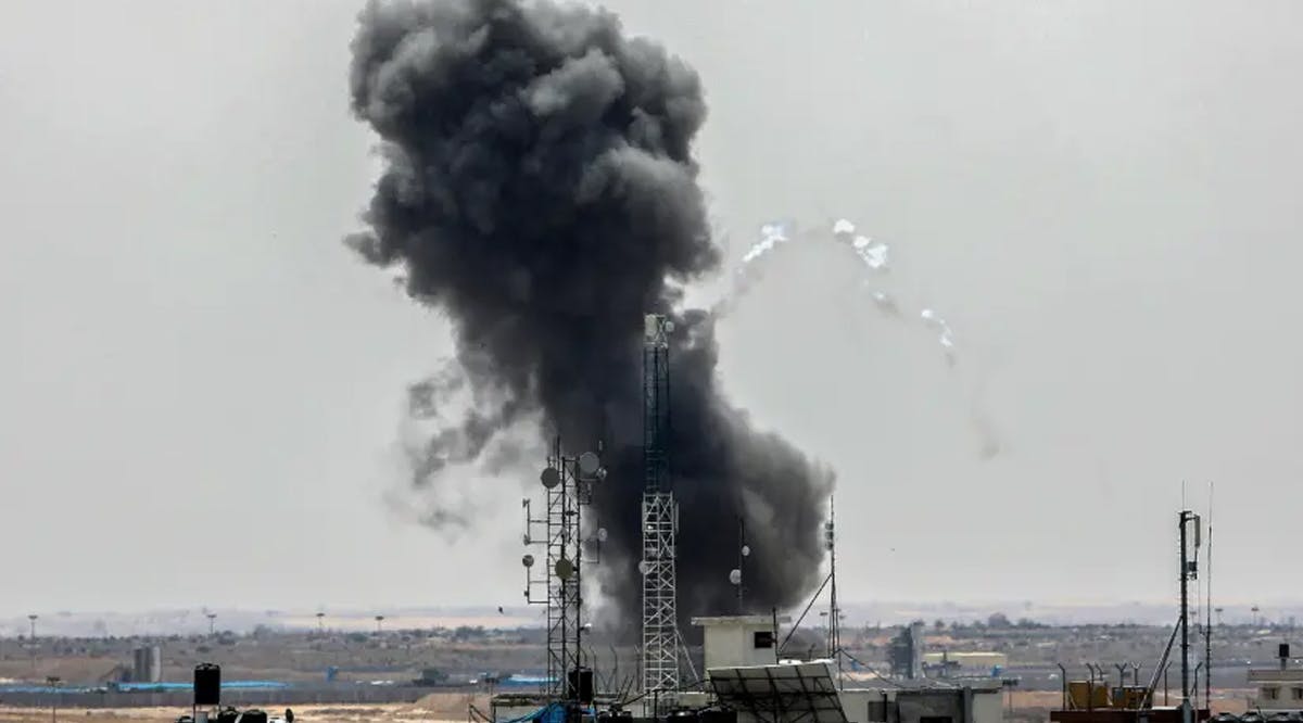 Smoke rises above buildings after air strikes by Israeli warplanes, in the southern Gaza Strip