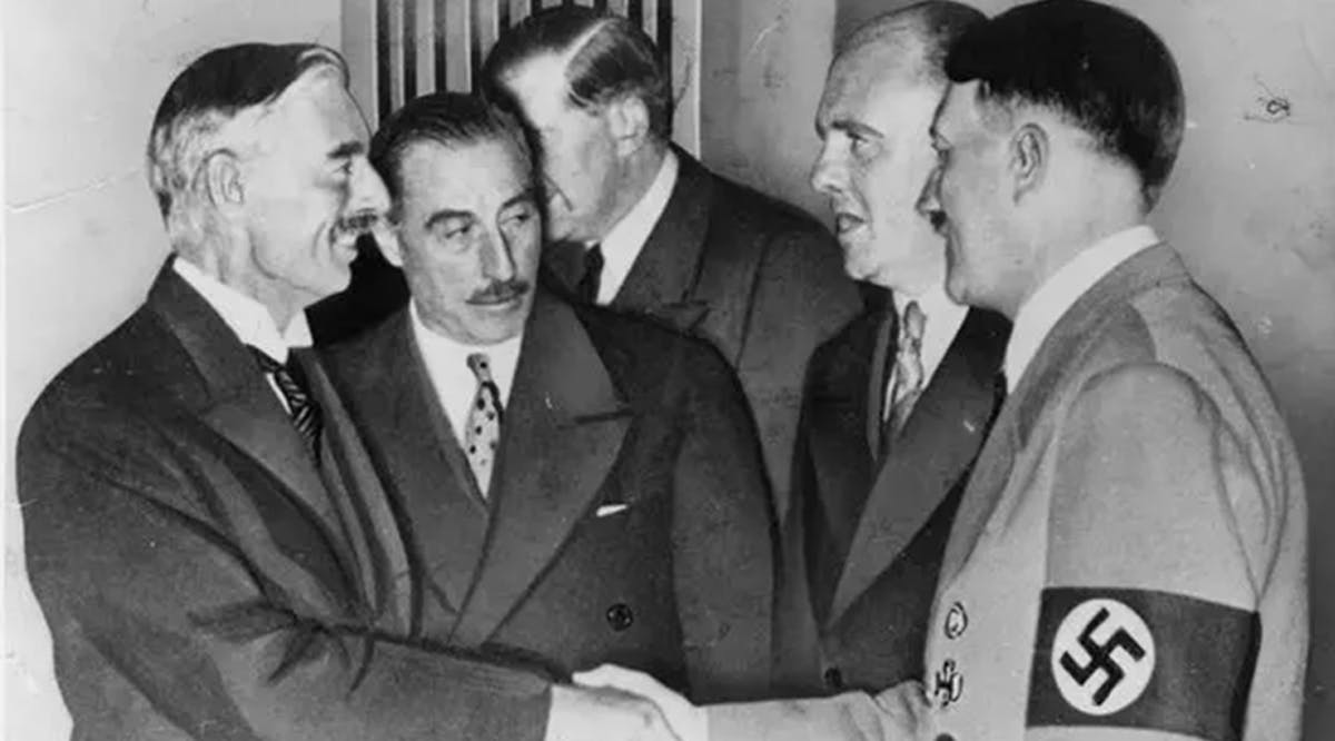 Neville Chamberlain, left, and Hitler sealing the Munich pact in September 1938