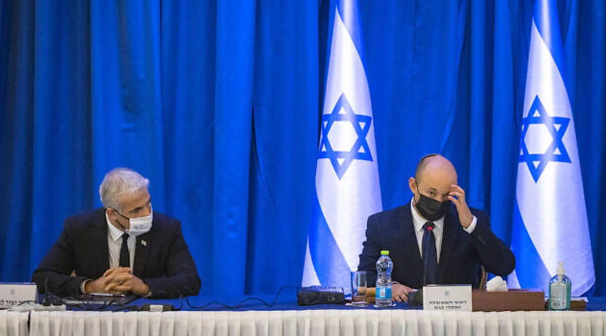 Prime Minister Naftali Bennett (R) and Minister of Foreign Affairs Yair Lapid