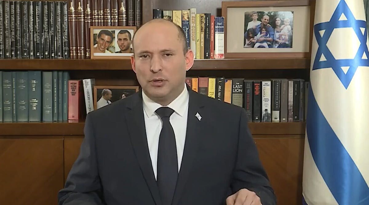 Prime Minister Naftali Bennett speaks from his Jerusalem office