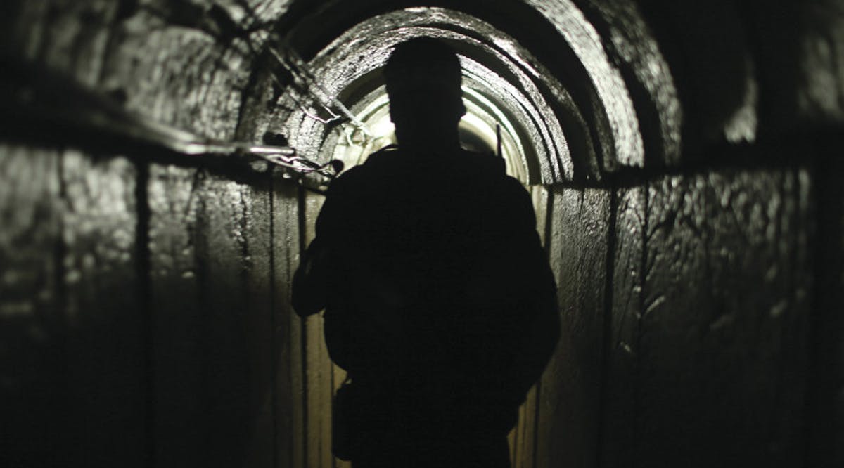 A fighter from the Izz el-Deen al-Qassam Brigades, Hamas’ armed wing, inside an underground tunnel, in Gaza