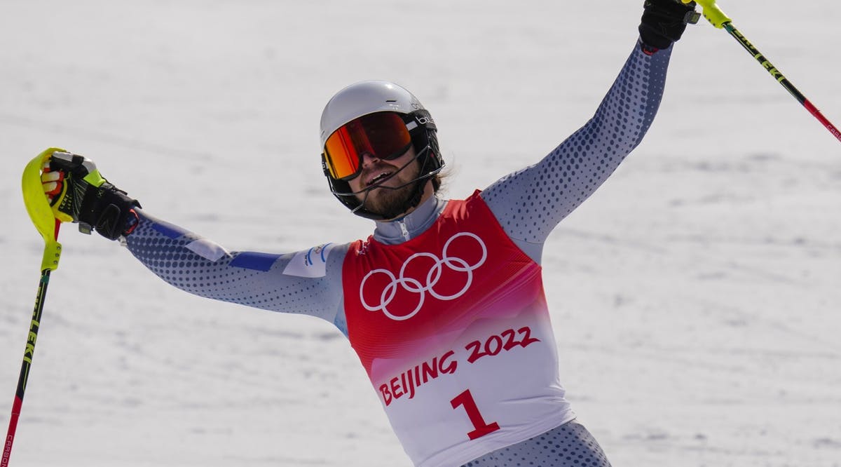Barnabas Szollos, of Israel, celebrates after finishing the slalom run of the men's combined at the 2022 Winter Olympics