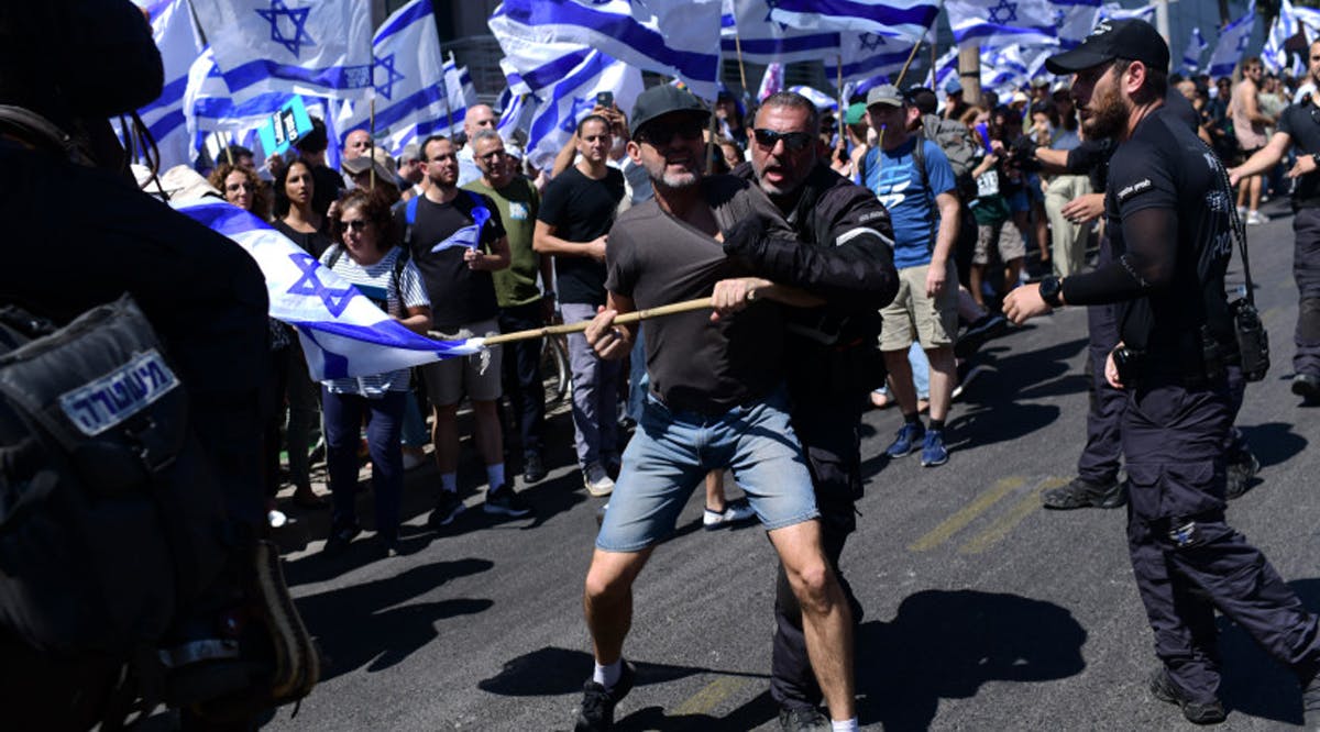 Anti-judicial reform demonstrators clash with police during a protest against the judicial overhaul in Tel Aviv