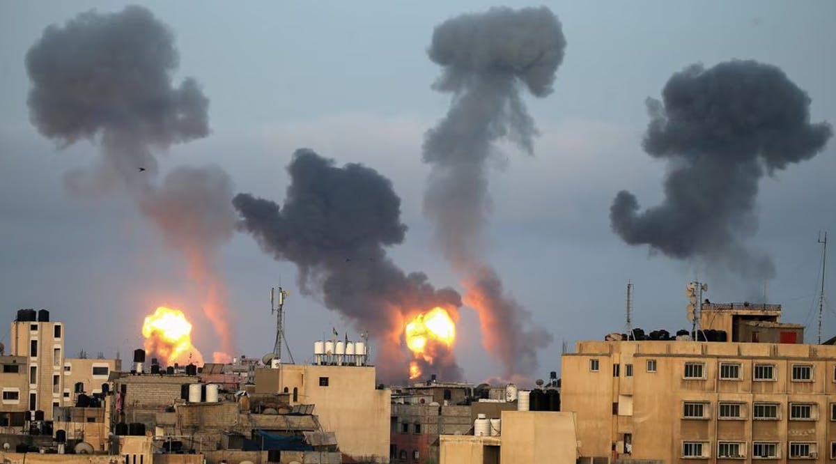 Flames and smoke rise during Israeli air strikes in the southern Gaza Strip
