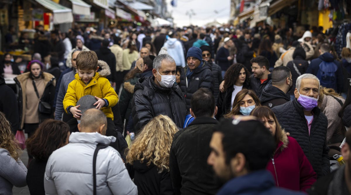 People shop at the Mahane Yehuda Market in Jerusalem