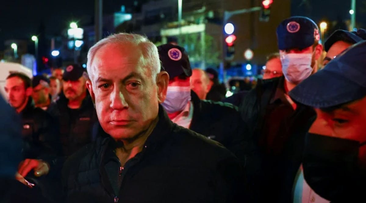 Israeli Prime Minister Benjamin Netanyahu visits the scene of a shooting attack on Friday