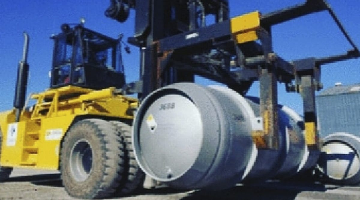 Forklift carries a cylinder containing uranium hexafluoride gas