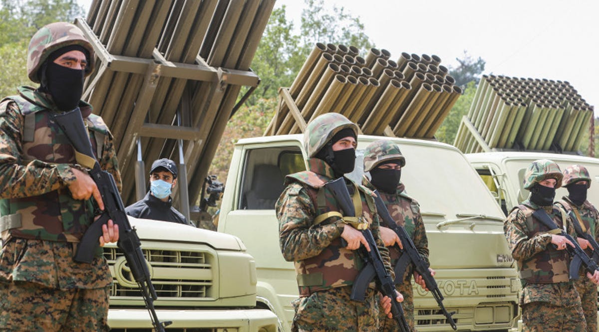 HEZBOLLAH MEMBERS take part in a military exercise