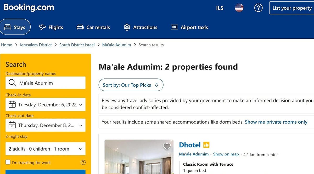 A Booking.com search for the settlement of Ma'ale Adumim shows a new travel advisory banner