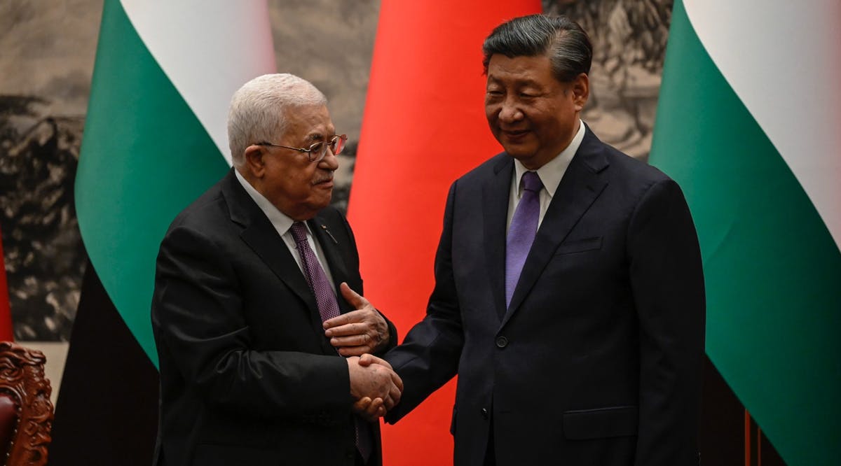 Palestinian Authority President Mahmoud Abbas (left) shakes hands with China's President Xi Jinping after a signing ceremony at the Great Hall of the People in Beijing