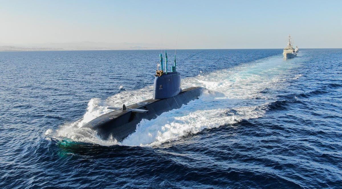 INS Tekuma Dolphin-class submarine is escorted by Saar 5 and 4.5 Class Corvettes during a drill in the Red Sea