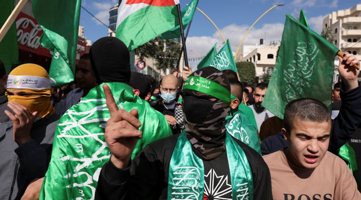Palestinians take part in a protest in support of Hamas