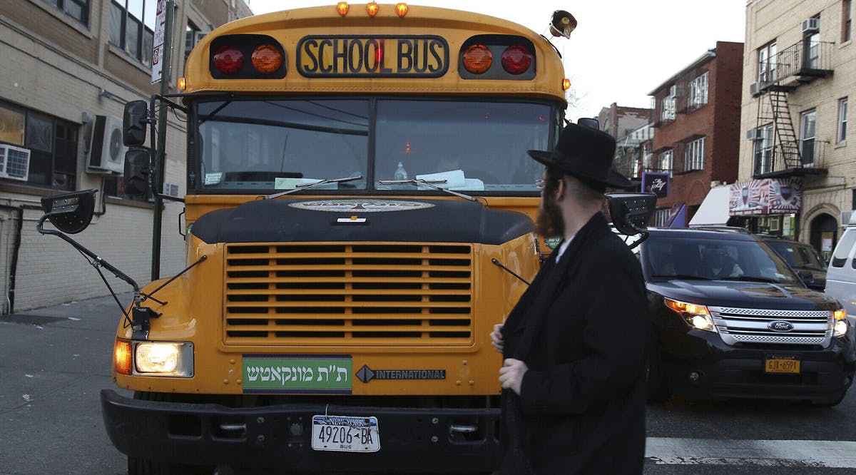 school bus with Yiddish signage in Borough Park, Brooklyn, New York City