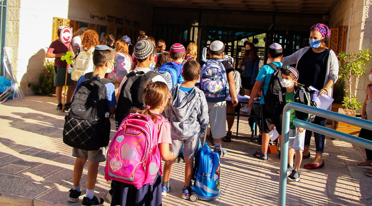 Israeli schoolchildren arrive for classes at a school