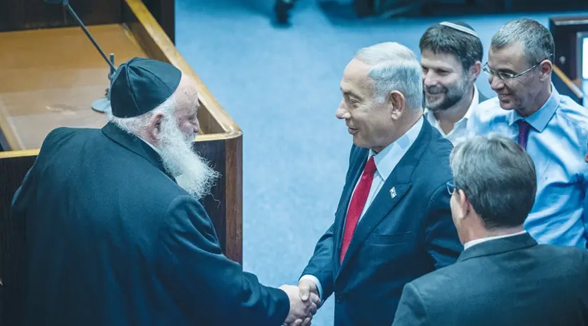 LIKUD LEADER BENJAMIN Netanyahu shakes hands with United Torah Judaism MK Yitzhak Goldknopf in the Knesset