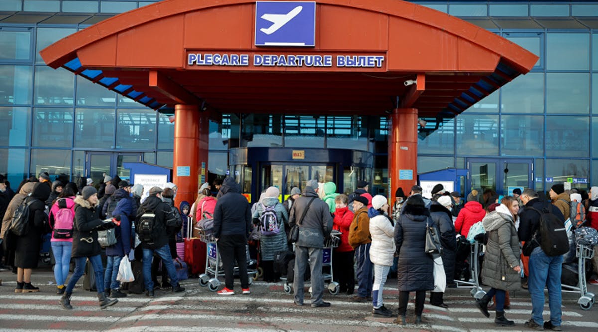 Ukrainians who fled fighting in Ukraine seen at the Chisinau International Airport in Moldova as they make their way to Israel