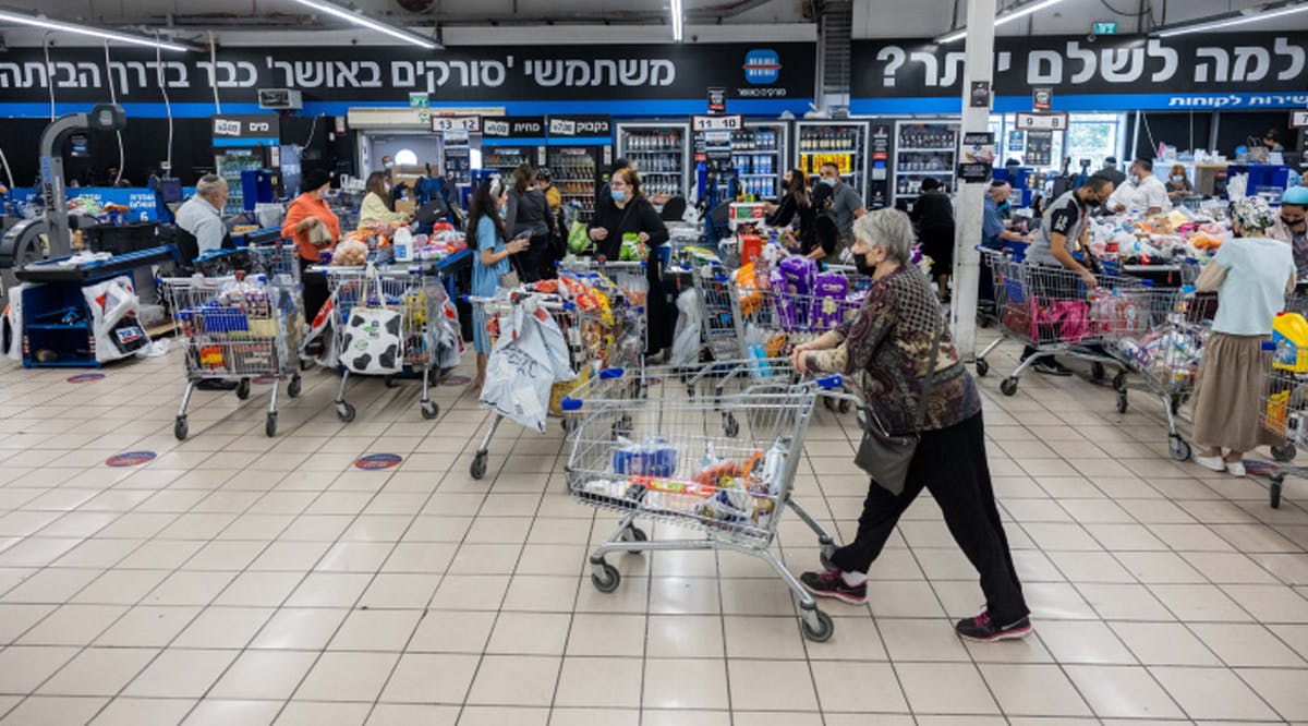 People shop at a supermarket in Givat Shaul, Jerusalem