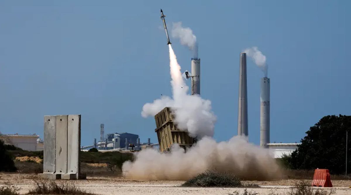 An Iron Dome anti-missile system fires an interceptor missile as a rocket is launched from the Gaza Strip towards Israel