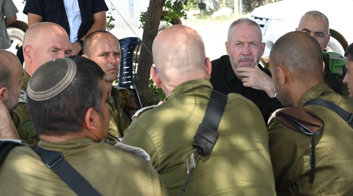 Defense Minister Yoav Gallant speaks with IDF officers during a drill in northern Israel