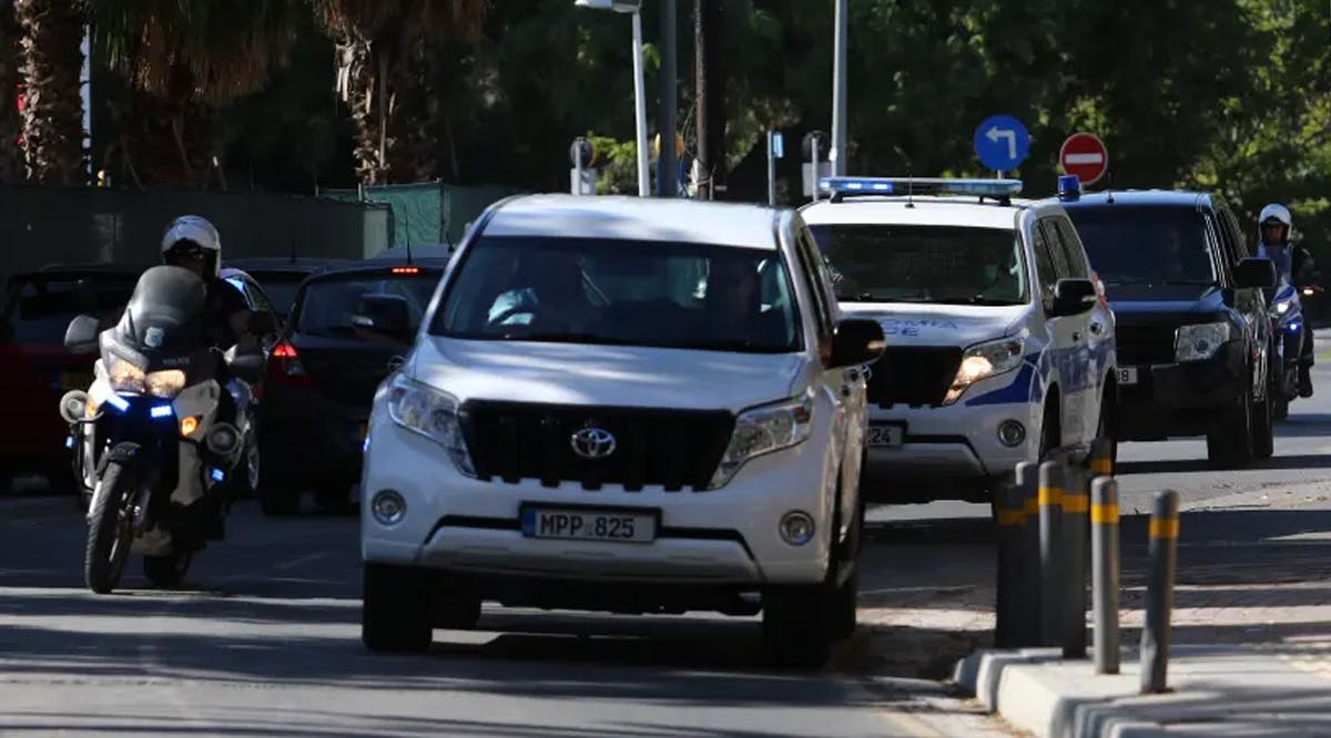Police vehicles arrive at a court, where a remand order was issued against a man suspected of plotting to murder Israeli businesspeople on the island, in Nicosia, Cyprus