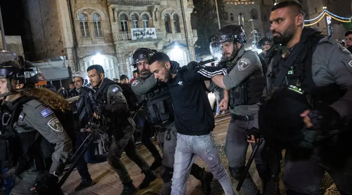 Israeli police officers arrest a man during clashes with protesters at Damascus Gate in Jerusalem's Old City