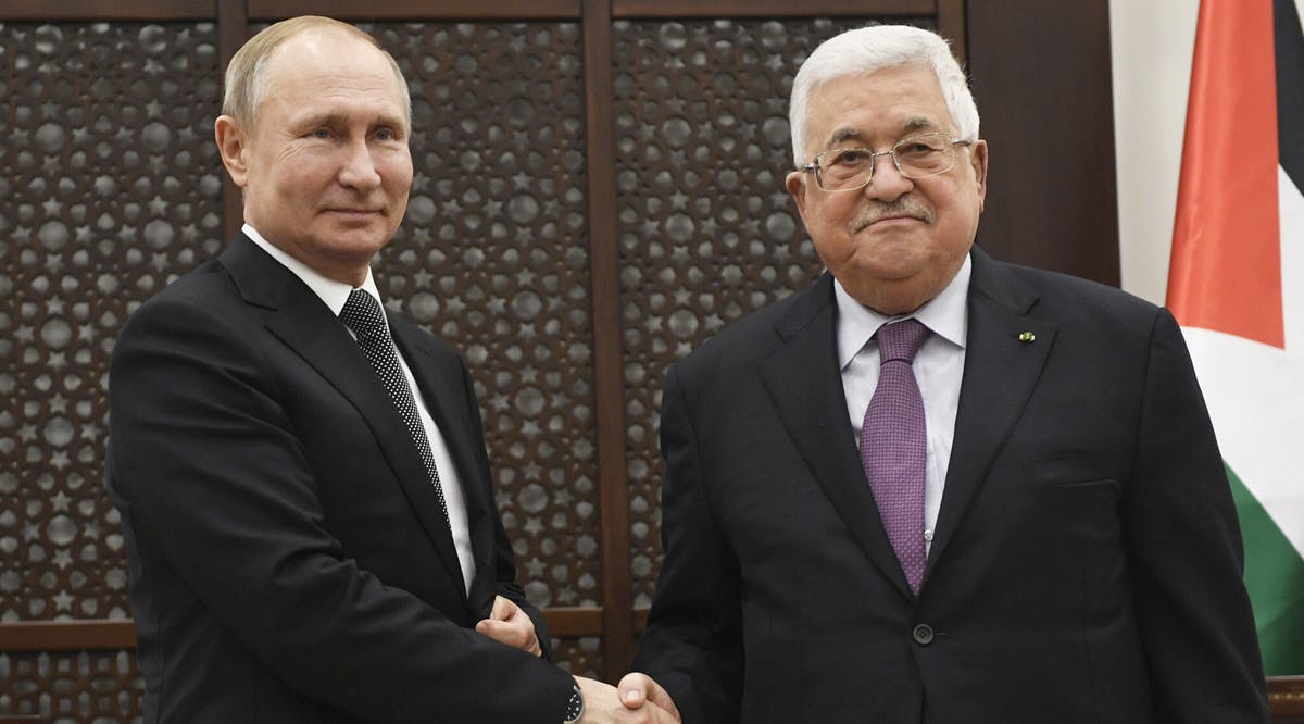 Palestinian President Mahmoud Abbas, shakes hands with Russian President Vladimir Putin