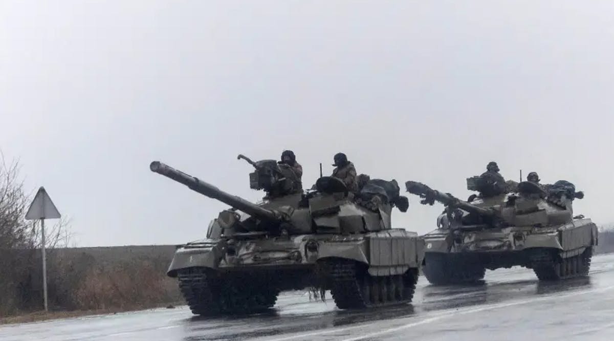 Ukrainian tanks move into the city, after Russian President Vladimir Putin authorized a military operation in eastern Ukraine