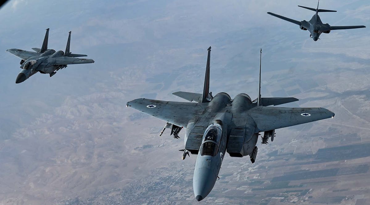 Israeli F-15s accompany a US B-1B Lancer over Israel