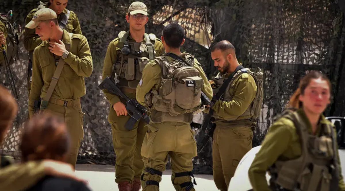 Israeli soldiers and rescue forces seen at Mount Harif military base in the southern Negev desert, close to the border with Egypt