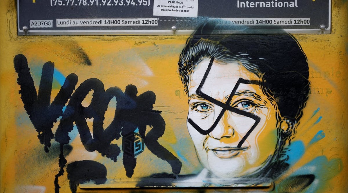 A vandalized mailbox with a swastika covering a portrait of the late Holocaust survivor and renowned French politician Simone Veil