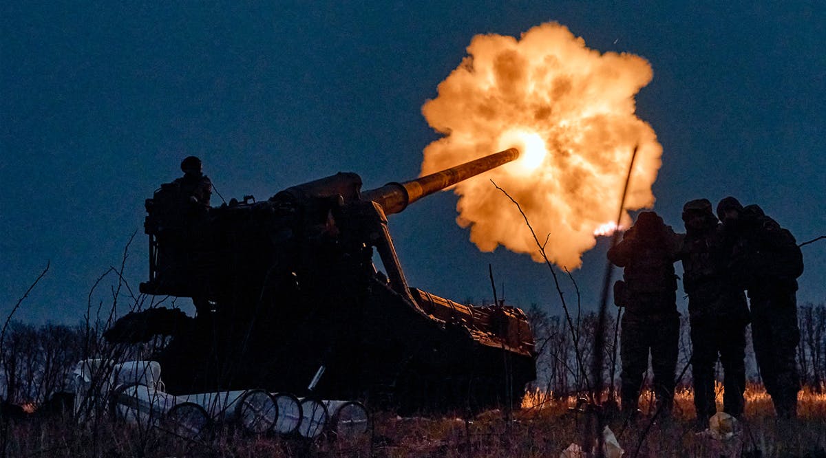 Ukrainian soldiers fire a Pion artillery system