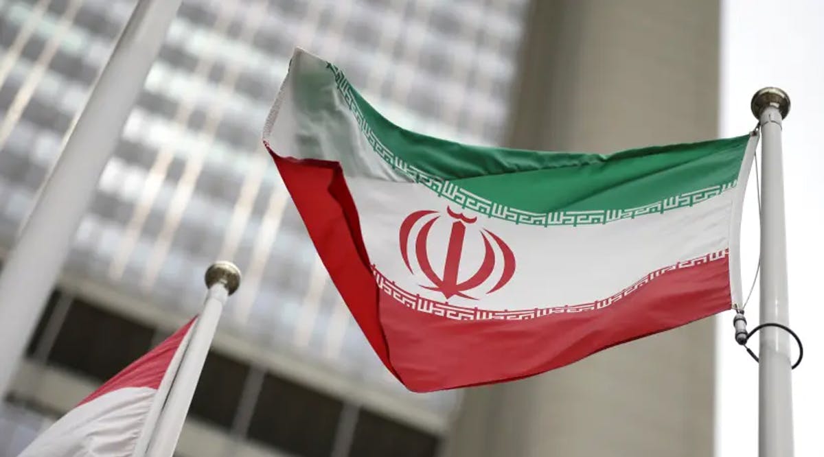 Iranian flag flies in front of the UN office building in Vienna