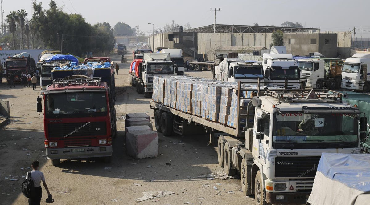 Humanitarian aid trucks enter through the Kerem Shalom crossing from Israel into the Gaza Strip