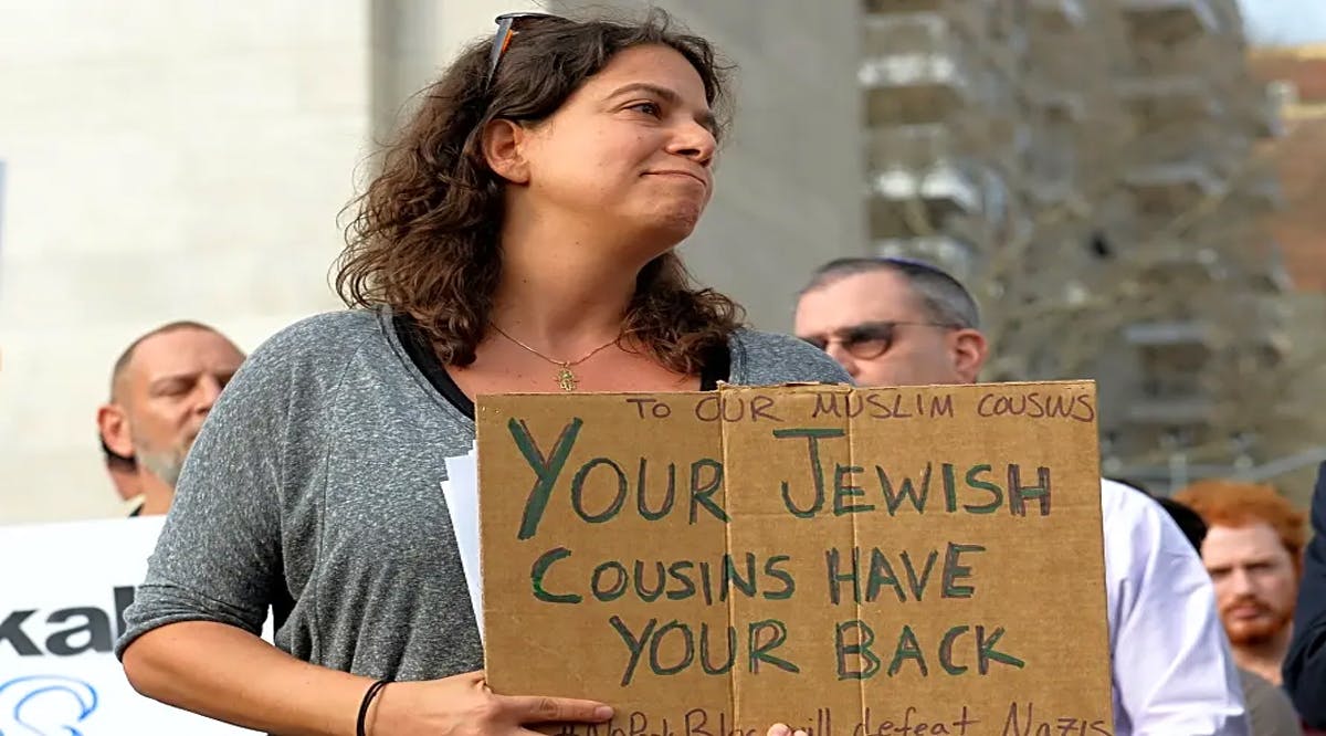 People gather at a vigil to mourn for the victims of the Christchurch mosque attack in New Zealand at Washington Square Park, New York City