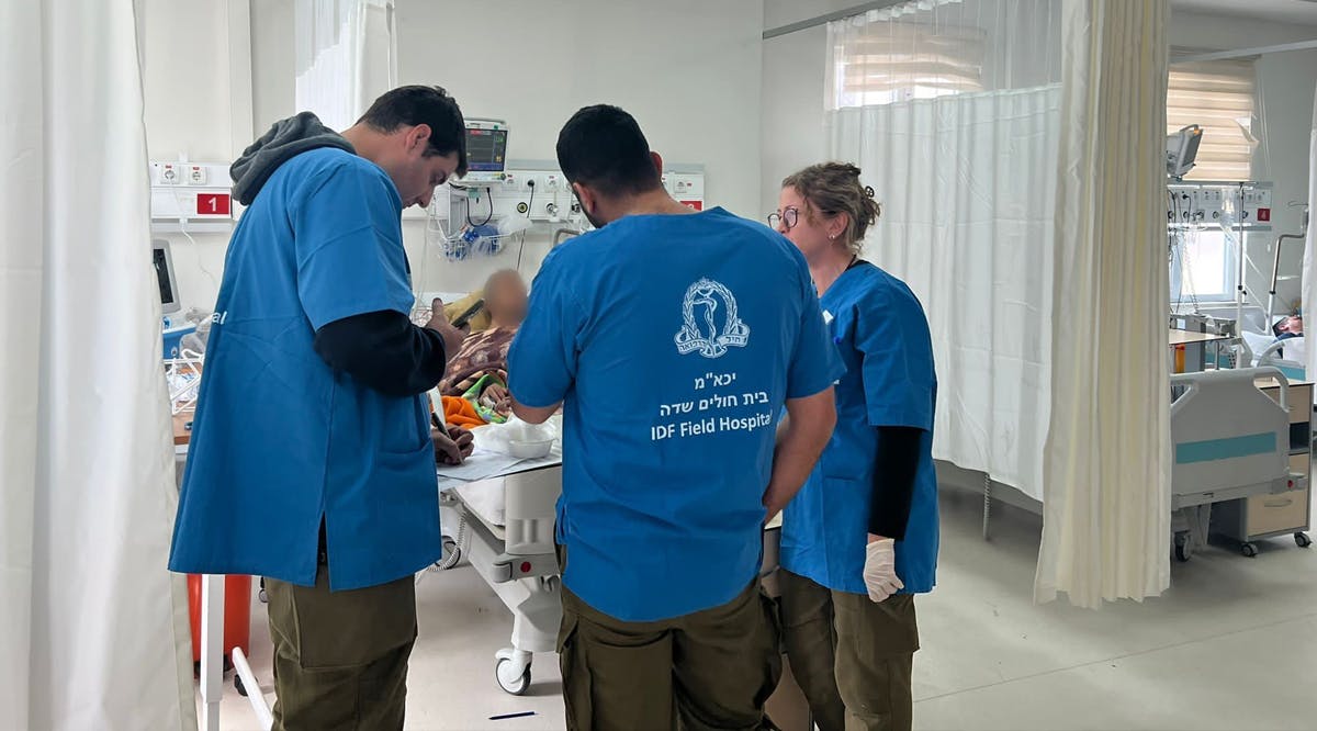 IDF medical officers treat wounded Turkish civillians at a field hospital near Kahramanmaraş