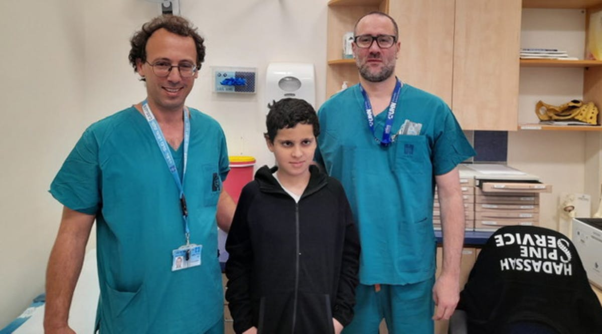 Dr. Ohad Einav and Ziv Asa with 12-year-old Suleiman Hassan at Hadassah Medical Center