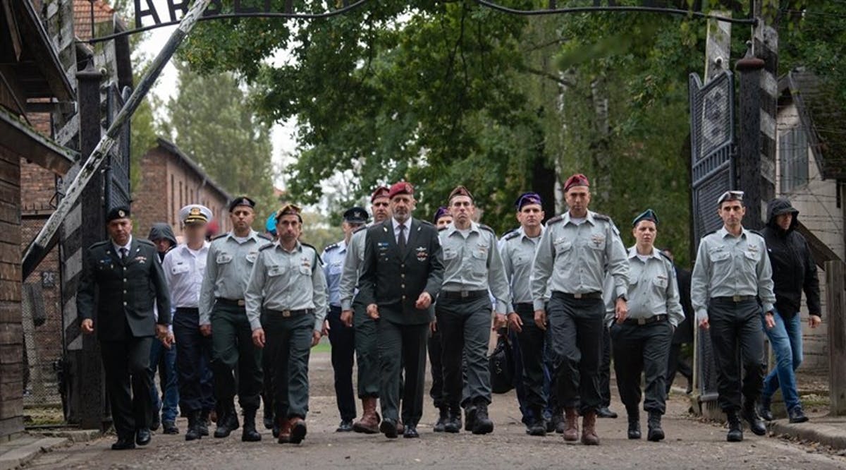 The Chief of Staff and his delegation at the entrance to the Auschwitz camp