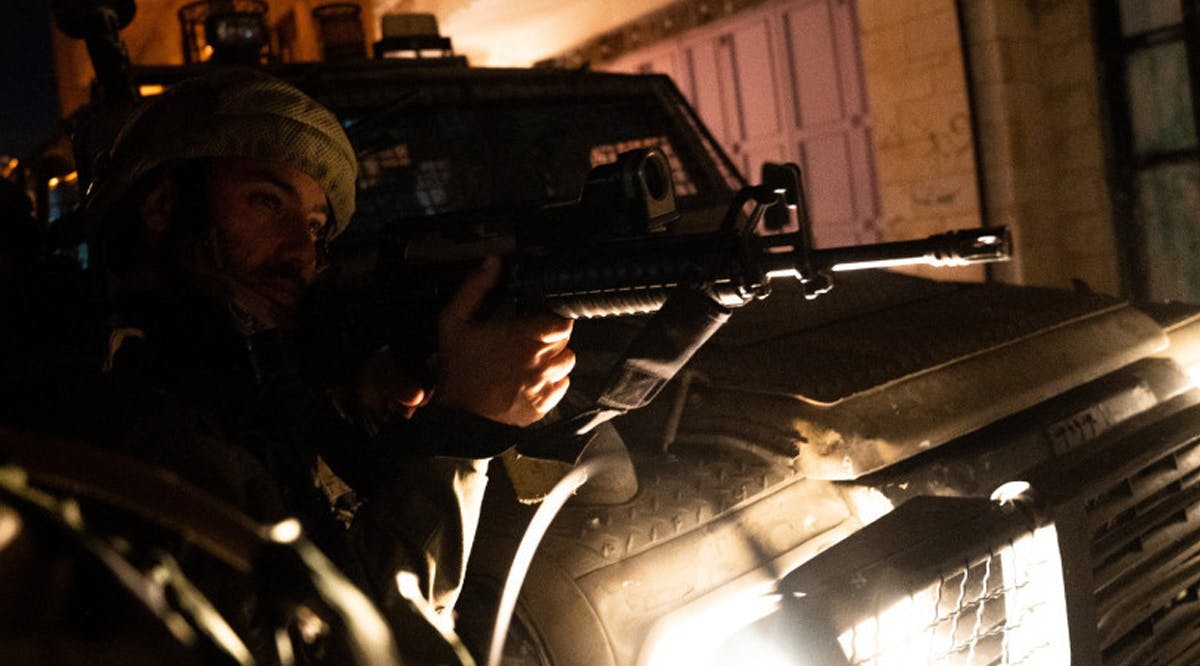IDF soldier holds position during West Bank overnight operations