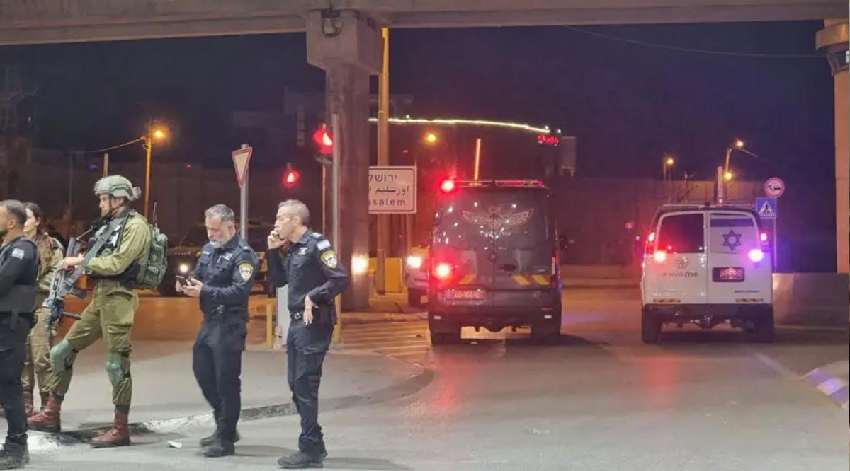 Police arrive at the scene where a security guard was slightly injured in a shooting incident with an attacker who walked on foot to the Kalandiya checkpoint from the West Bank